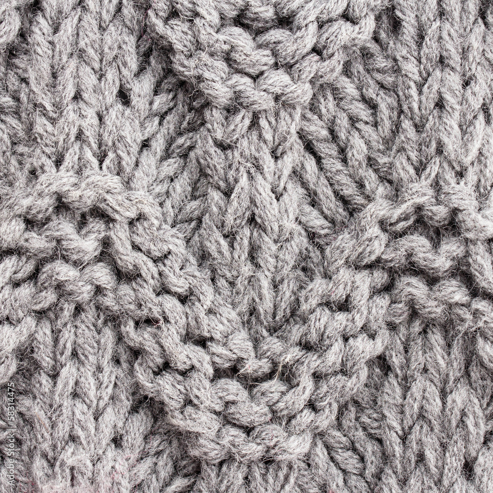 Gray knitting background texture. Knit woolen Fabric textile mu Gray knitting background texture. Knit woolen Fabric textile mu