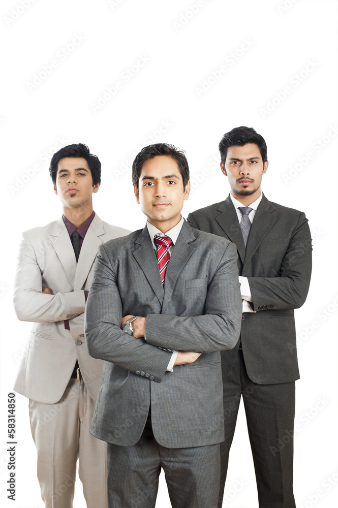 Portrait of three businessmen standing with their arms crossed Portrait of three businessmen standing with their arms crossed