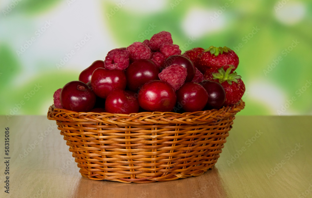 Basket with cherry and strawberry berries Basket with cherry and strawberry berries