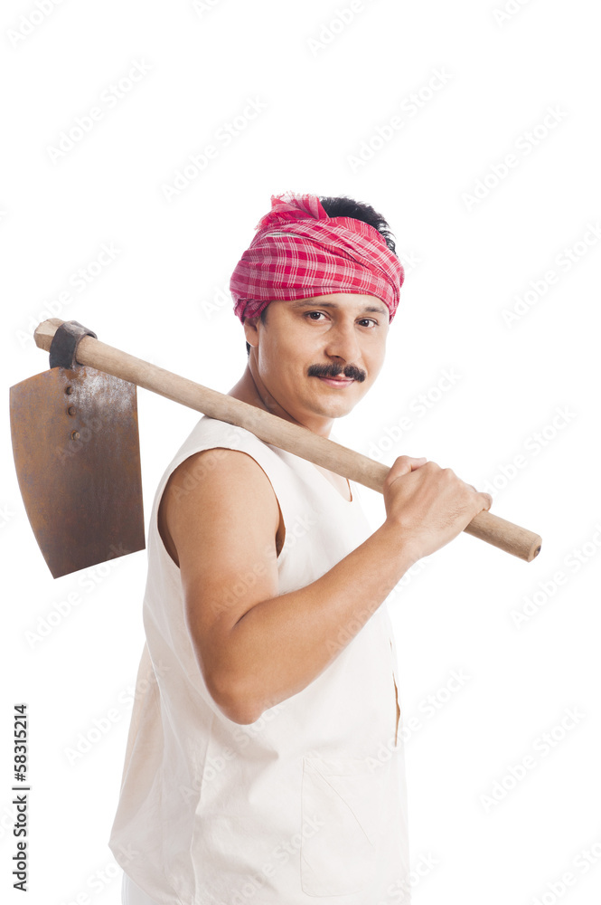 Portrait of a farmer carrying spade on his shoulders Portrait of a farmer carrying spade on his shoulders