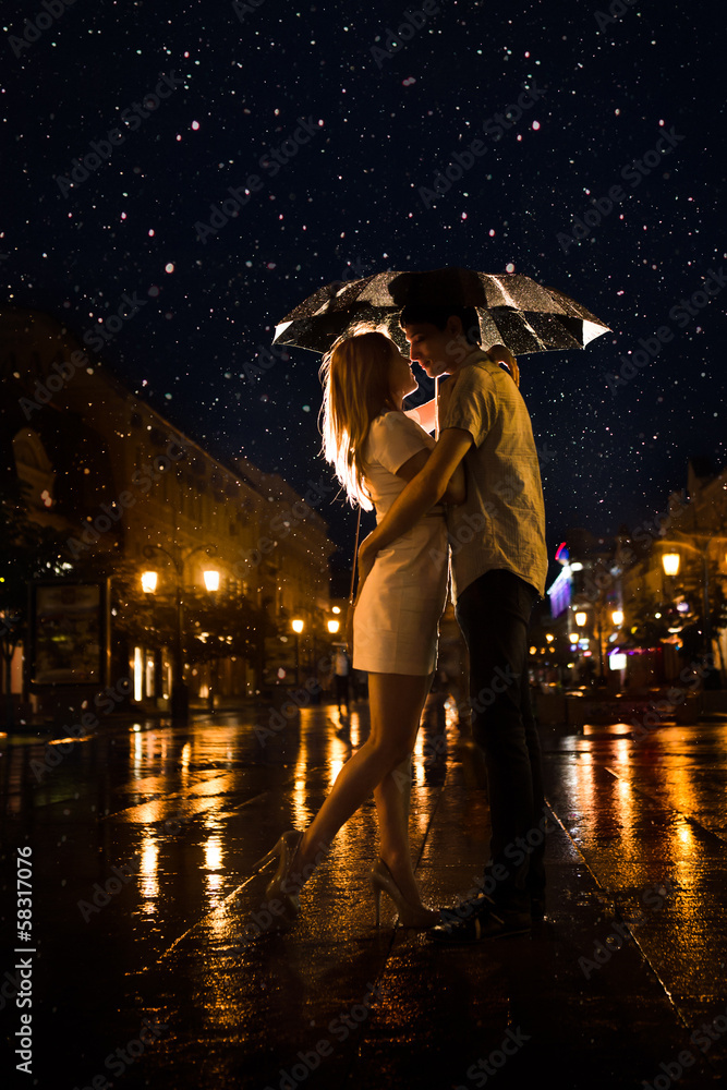 Love in the rain / Silhouette of kissing couple under umbrella Stock Photo  | Adobe Stock