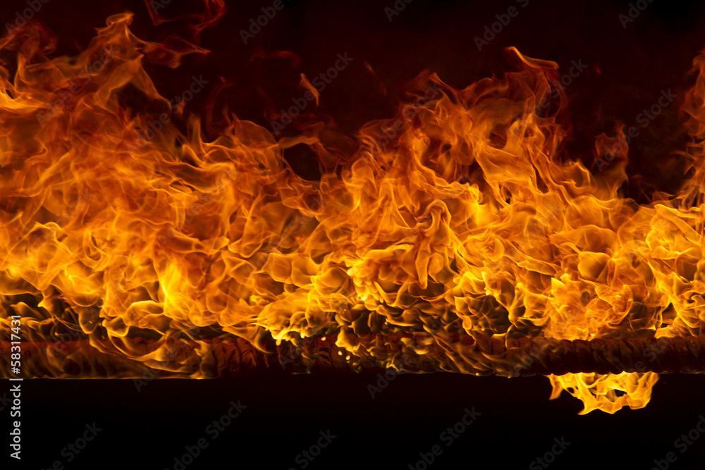 Fototapeta premium Blazing flames on black background
