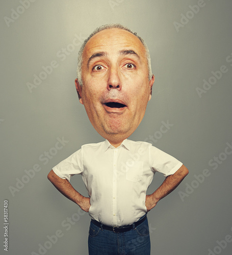 excited bighead man over grey photo