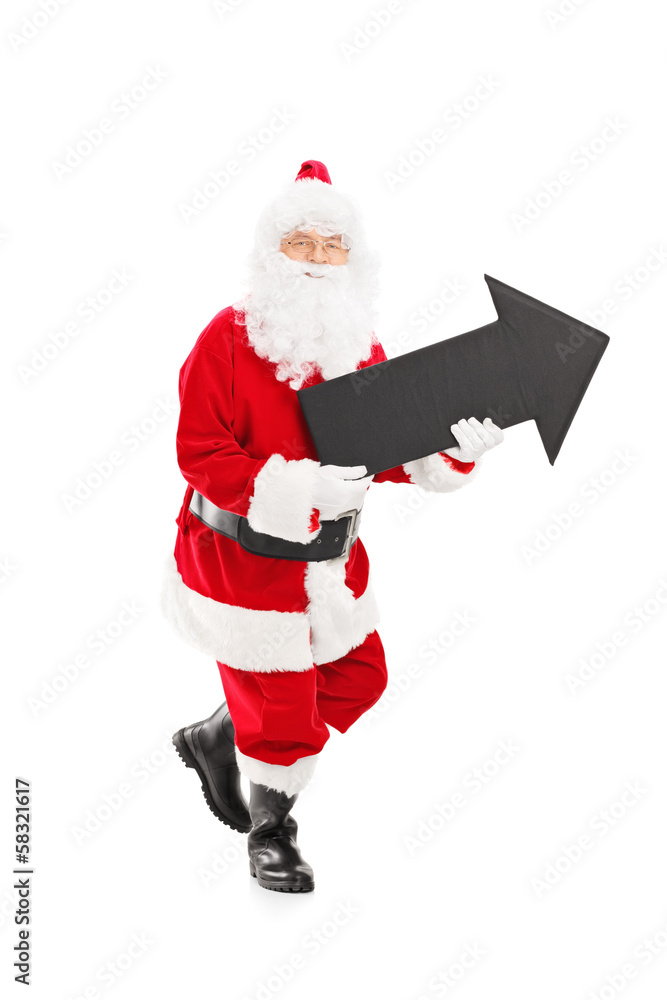 Smiling Santa Claus holding a big black arrow Smiling Santa Claus holding a big black arrow