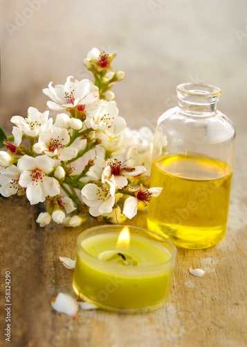 bunch of spring flower  massage oil on board