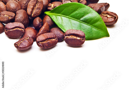 Black coffee beans, grain with leaf on white background.