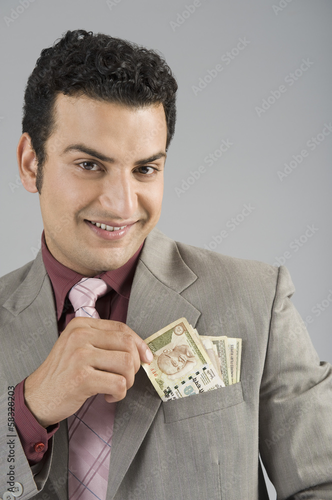 Businessman with Indian five hundred rupee banknotes in his pocket Businessman with Indian five hundred rupee banknotes in his pocket