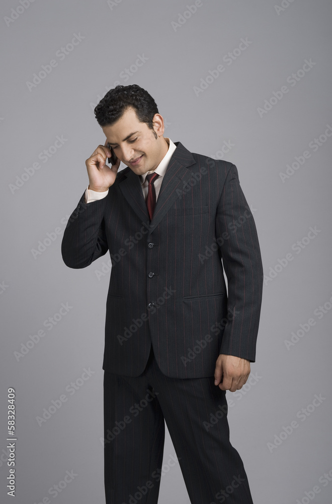 Businessman talking on a mobile phone Businessman talking on a mobile phone