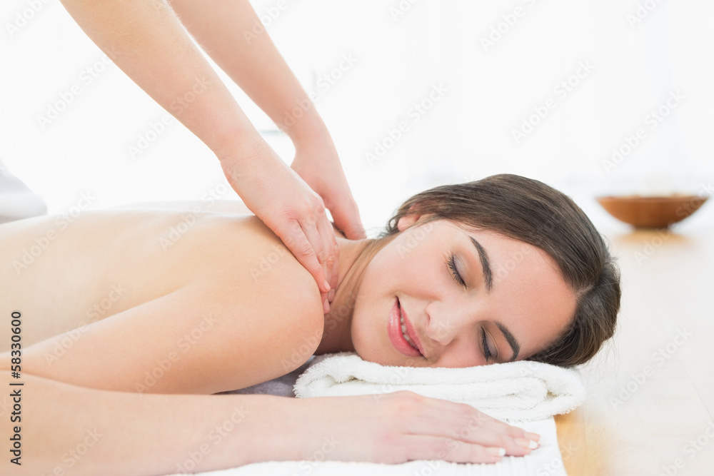 Beautiful woman enjoying neck massage at beauty spa Beautiful woman enjoying neck massage at beauty spa
