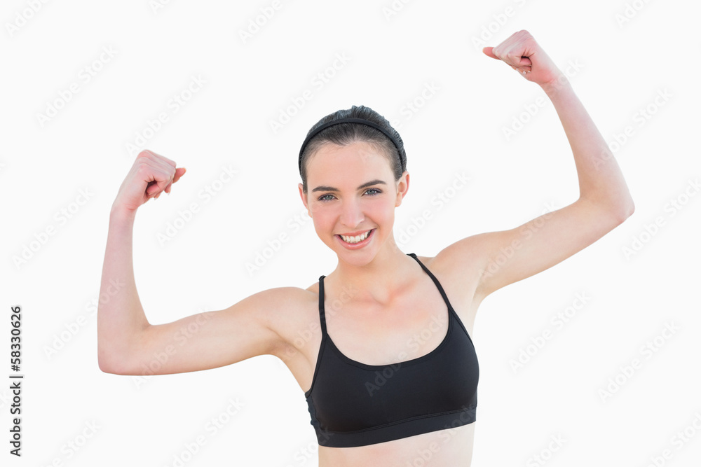 Portrait of sporty fit young woman clenching fists Portrait of sporty fit young woman clenching fists