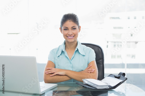 Elegant businesswoman with laptop in office