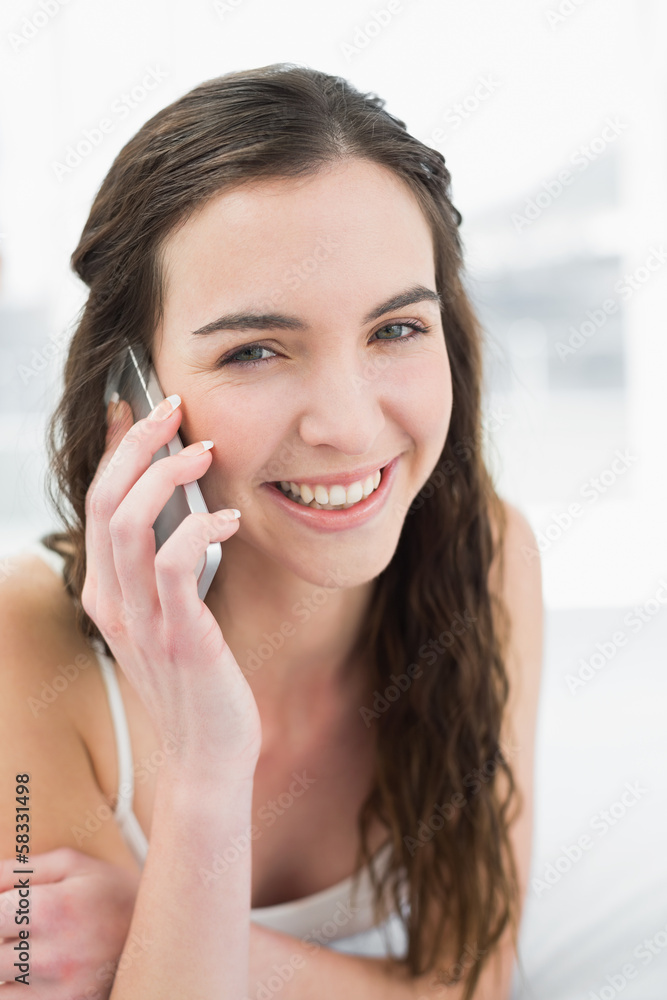 Close up of relaxed woman using mobile phone in bed Close up of relaxed woman using mobile phone in bed