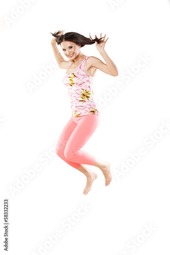 cute girl jumps on a white background