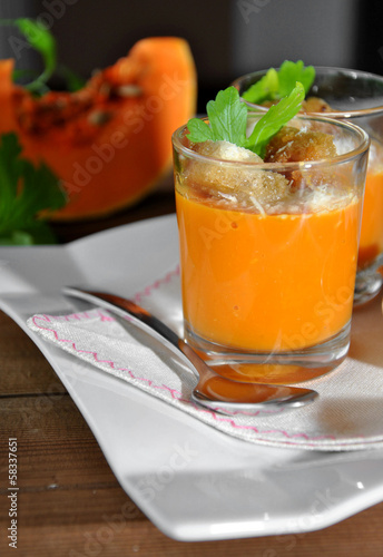 two glasses with pumpkin soup and bread