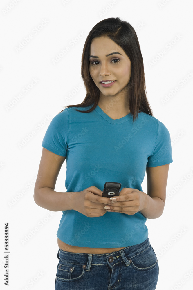 Portrait of a woman holding a mobile phone Portrait of a woman holding a mobile phone