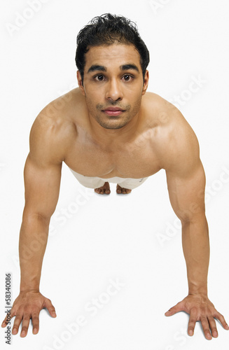 Portrait of a man doing push-ups