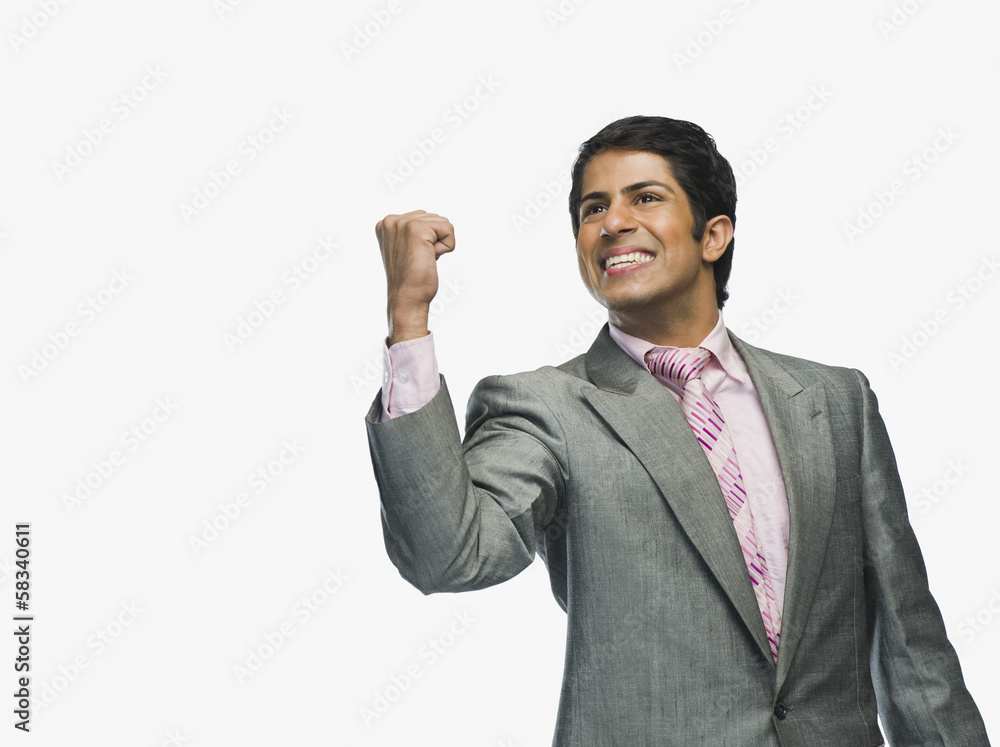 Businessman clenching fist in excitement Businessman clenching fist in excitement