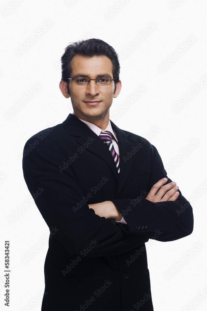 Portrait of a businessman standing with his arms crossed Portrait of a businessman standing with his arms crossed