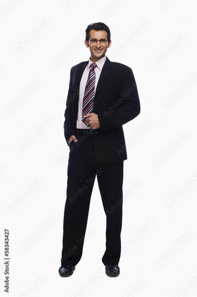 Portrait of a businessman standing with his hand in pocket Portrait of a businessman standing with his hand in pocket