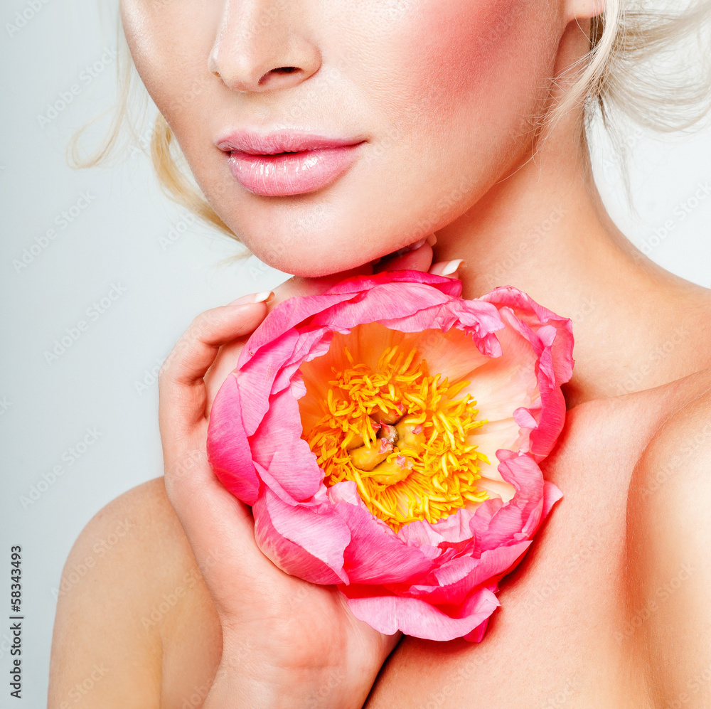 beautiful blonde girl with pink flower. perfect skin. beautiful blonde girl with pink flower. perfect skin.