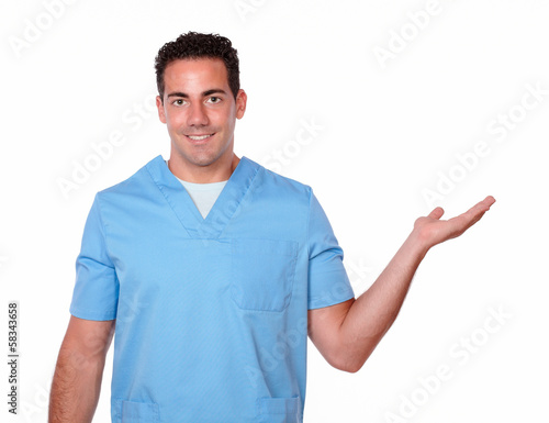 Handsome male nurse holding his left palm