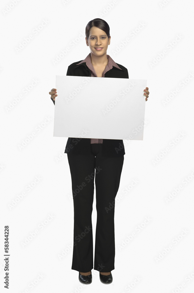 Businesswoman showing a placard and smiling