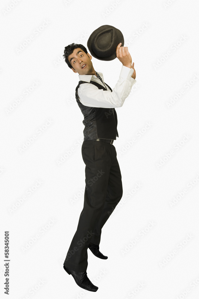 Obraz premium Portrait of a businessman holding a hat