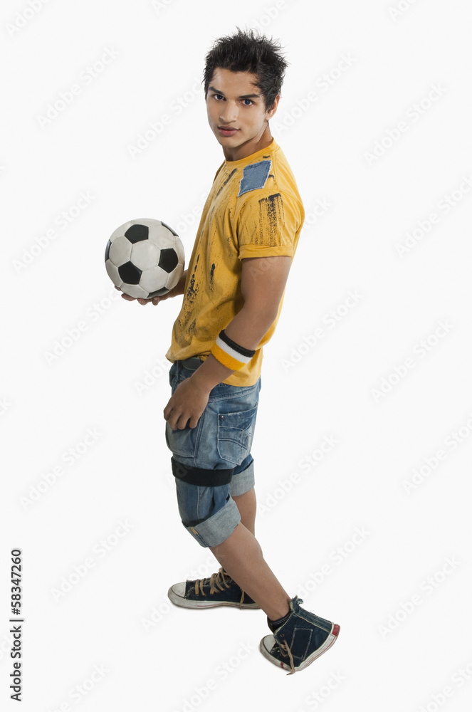 Portrait of a man holding a soccer ball