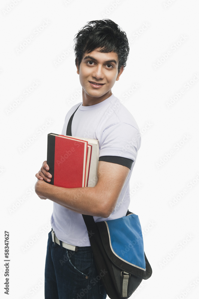 Portrait of a college student holding notebooks Portrait of a college student holding notebooks
