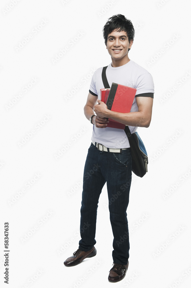 Portrait of a college student holding notebooks Portrait of a college student holding notebooks