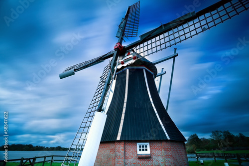 Dutch windmill over blurred sky