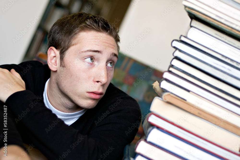 Worried Student Looking At Books