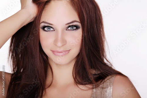 Positively smiling young girl with blue eyes and long hair isola