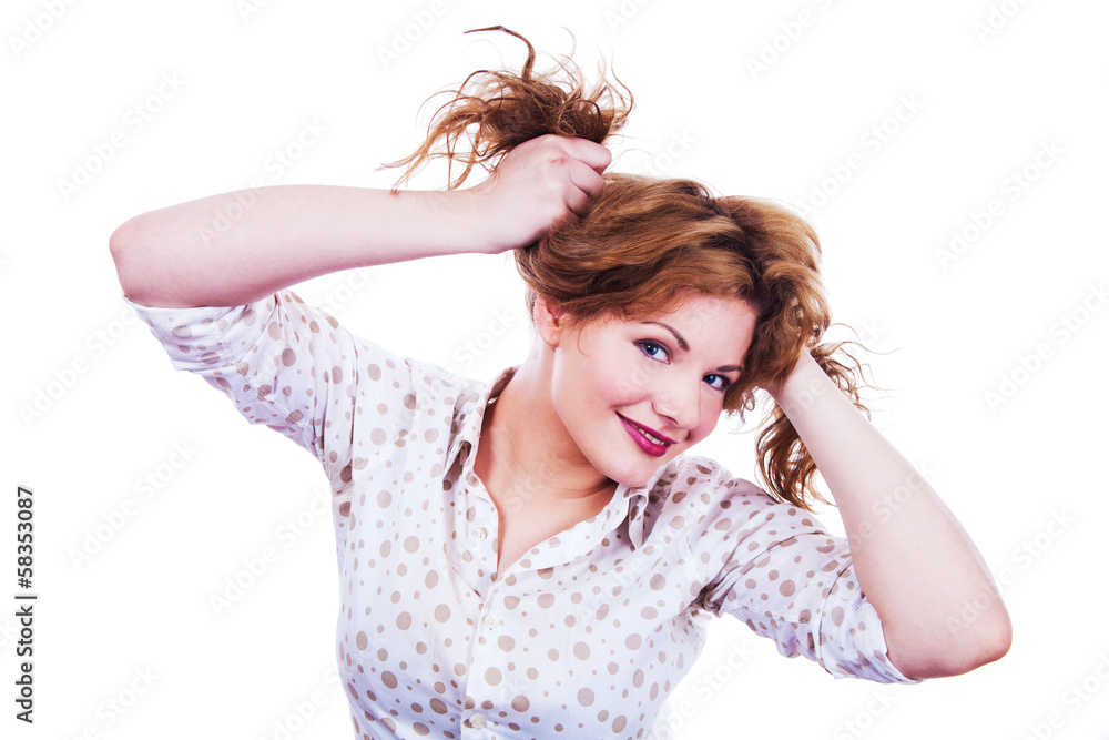 Portrait of a young woman holding her hair Portrait of a young woman holding her hair