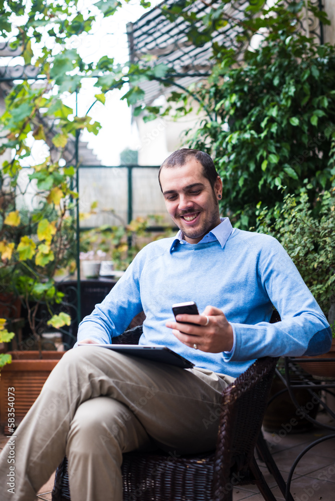 Fototapeta premium elegant business multitasking multimedia man at home