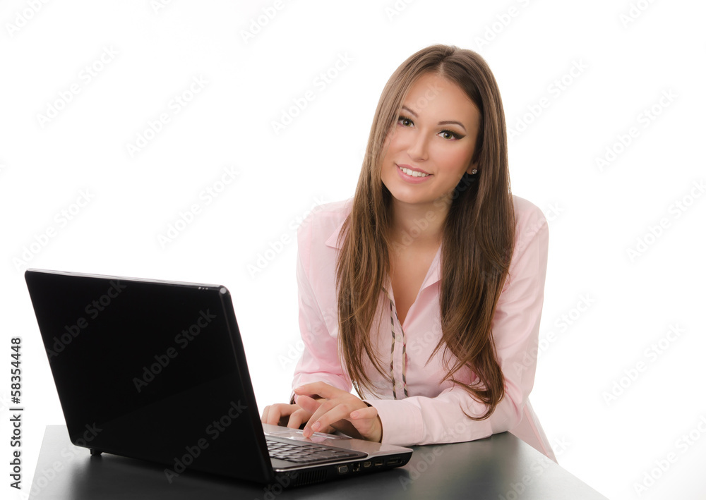 Happy business woman working on a laptop Happy business woman working on a laptop