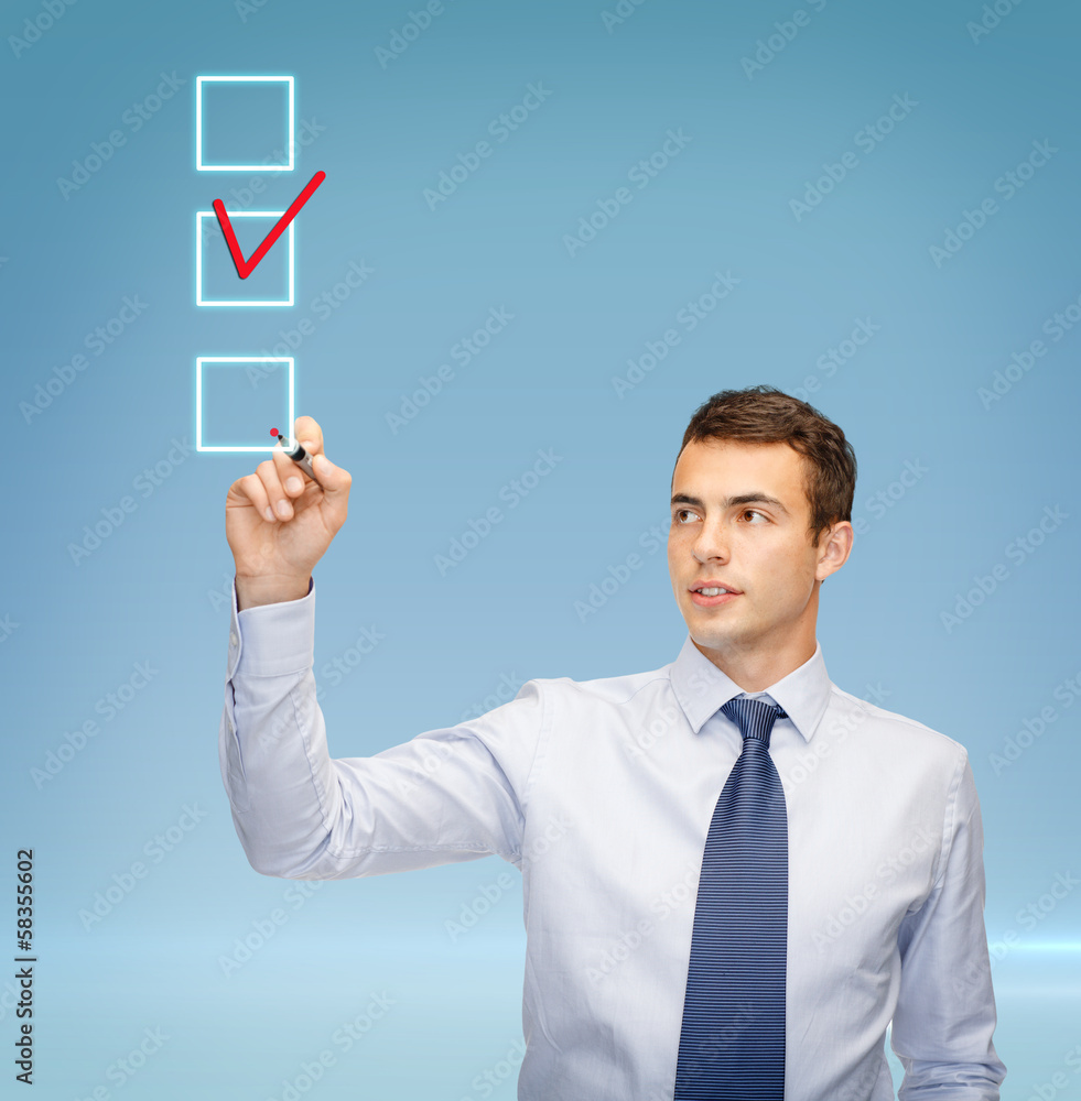 attractive buisnessman or teacher with marker attractive buisnessman or teacher with marker