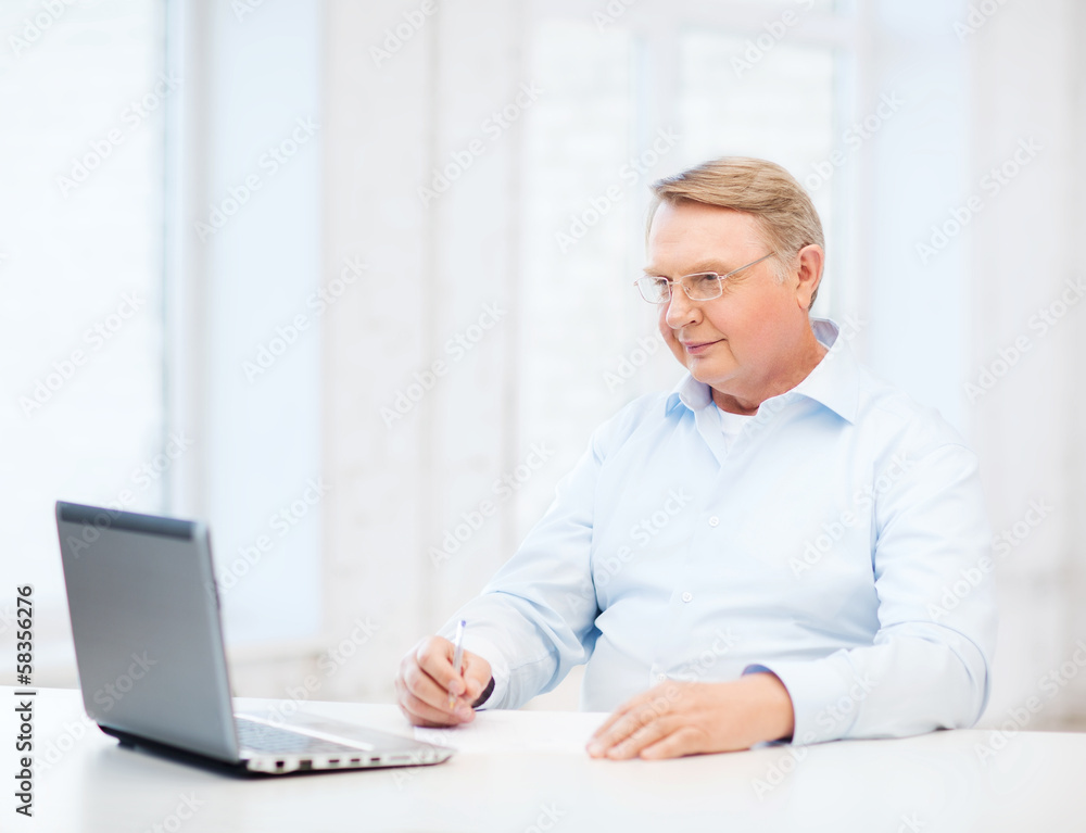 old man in eyeglasses filling a form at home old man in eyeglasses filling a form at home