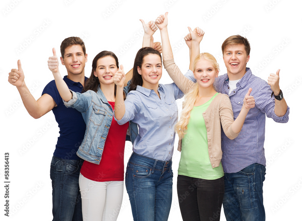 group of smiling students showing thumbs up group of smiling students showing thumbs up