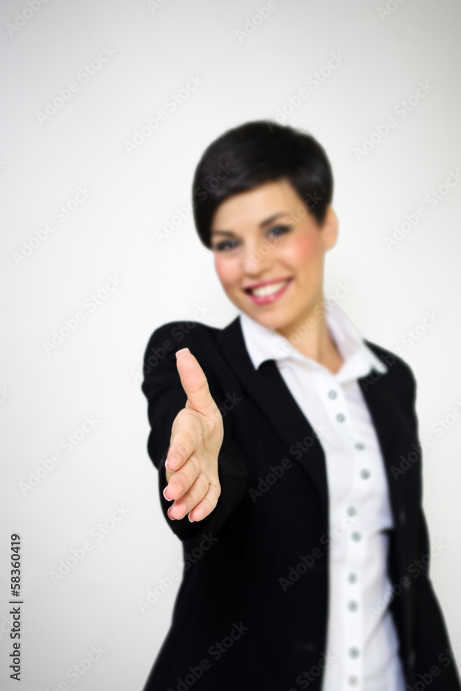 Welcoming business woman giving handshake Welcoming business woman giving handshake