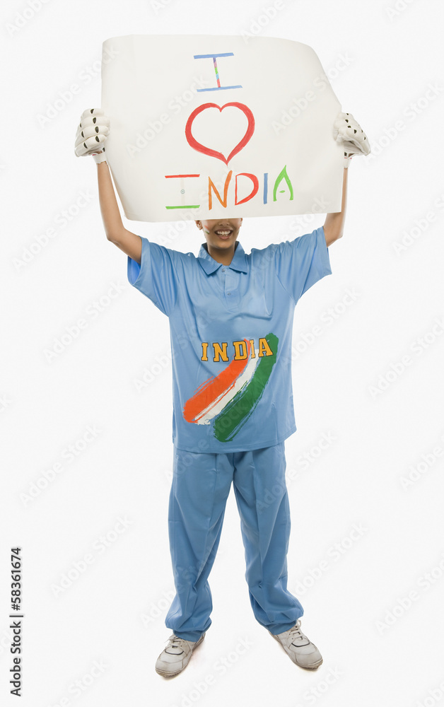 Woman in cricket uniform holding a placard with text I Love India written on it Woman in cricket uniform holding a placard with text I Love India written on it
