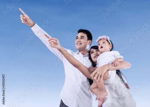 Happy family with blue sky