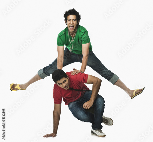 Two university students playing leapfrog