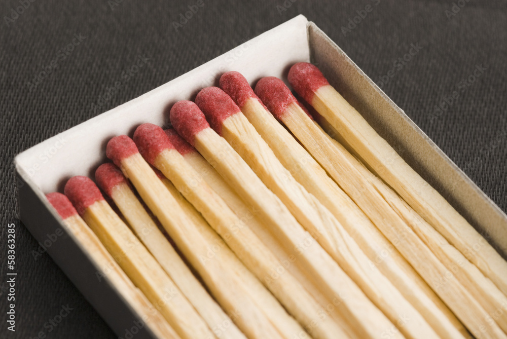 Close-up of an open matchbox with matchsticks Close-up of an open matchbox with matchsticks