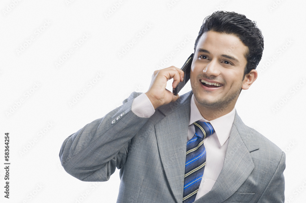 Businessman talking on a mobile phone Businessman talking on a mobile phone