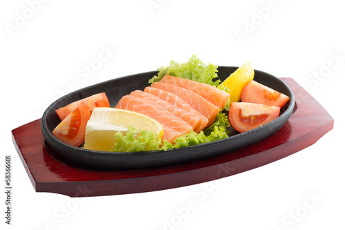 fresh raw salmon fish pieces on plate isolated