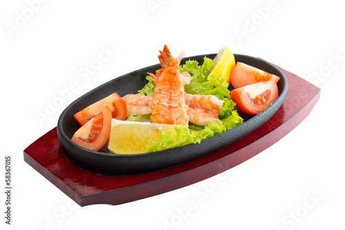 fried shrimp with vegetables on plate isolated