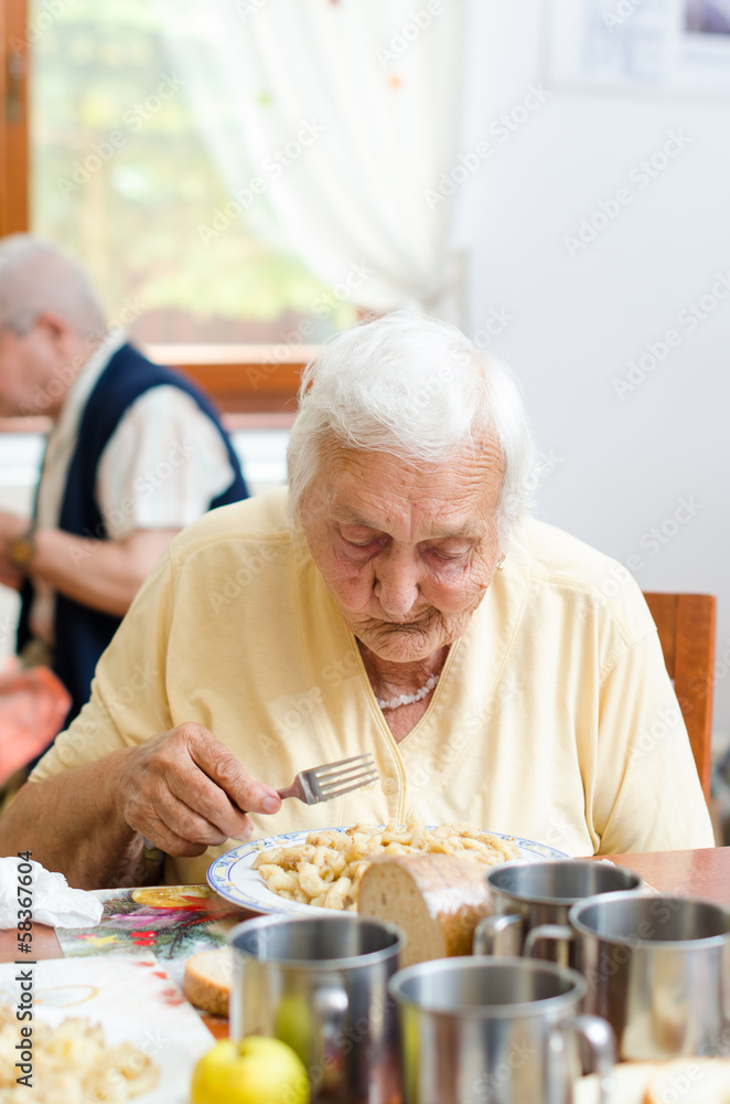 senior woman eating senior woman eating