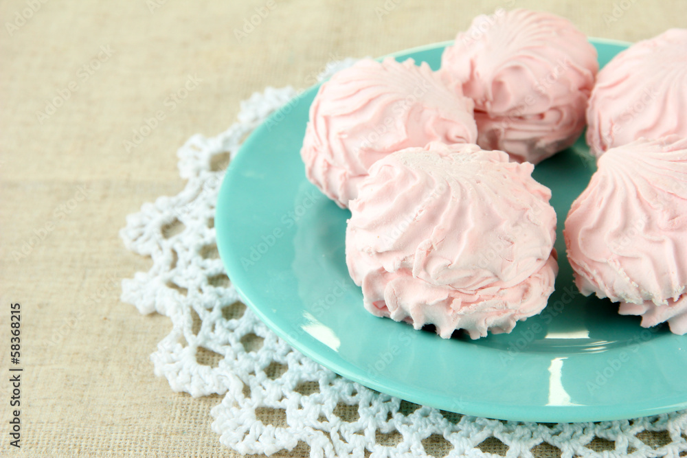 Marshmallows on color plate on light background Marshmallows on color plate on light background