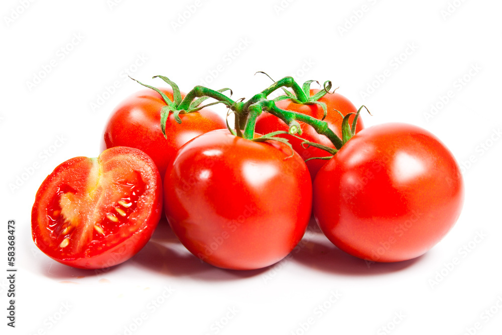 Closeup of tomatoes on the vine isolated on white Closeup of tomatoes on the vine isolated on white